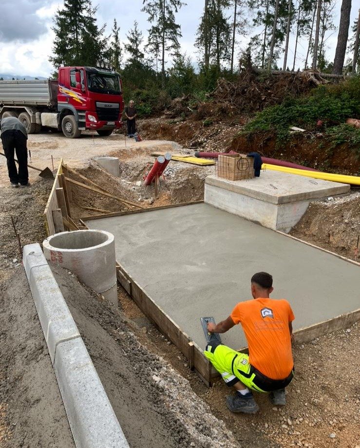 Concrete pad with worker
